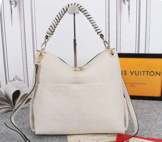 Louis Vuitton Monogram Empreinte Leather Maida Hobo In Cream