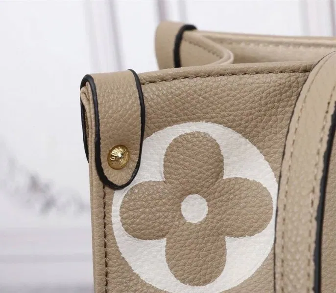 Louis Vuitton Monogram Empreinte OnTheGo MM Tote In Tourterelle Gray — image 8