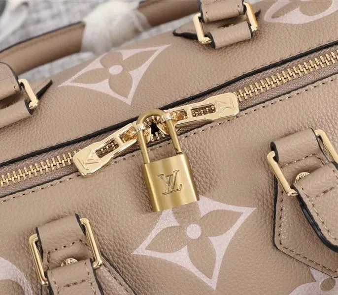Louis Vuitton Bicolor Monogram Empreinte Leather Speedy Bandouliere 25 Handbag In Tourterelle Gray And Cream — image 8