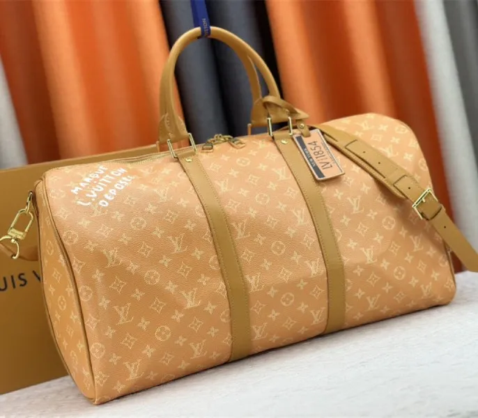 Louis Vuitton Monogram Heritage Canvas Keepall Bandouliere 50 In Yellow — image 2