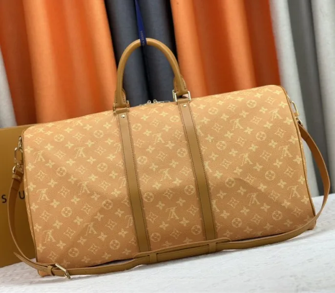 Louis Vuitton Monogram Heritage Canvas Keepall Bandouliere 55 In Yellow — image 4