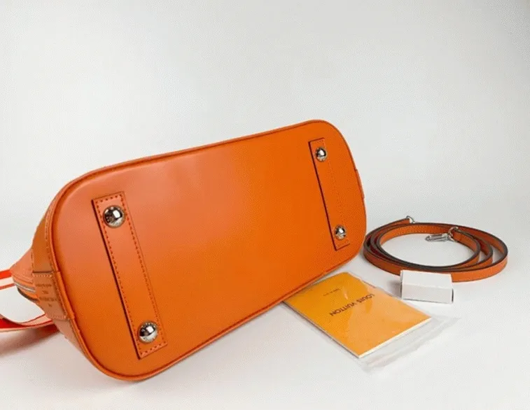 Louis Vuitton Epi Leather Alma PM Handbag In Orange With Jacquard Strap — image 6