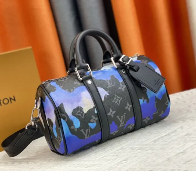 Louis Vuitton Monogram Eclipse Keepall Bandouliere 25 Travel Bag In Blue And Purple Sunrise — image 2