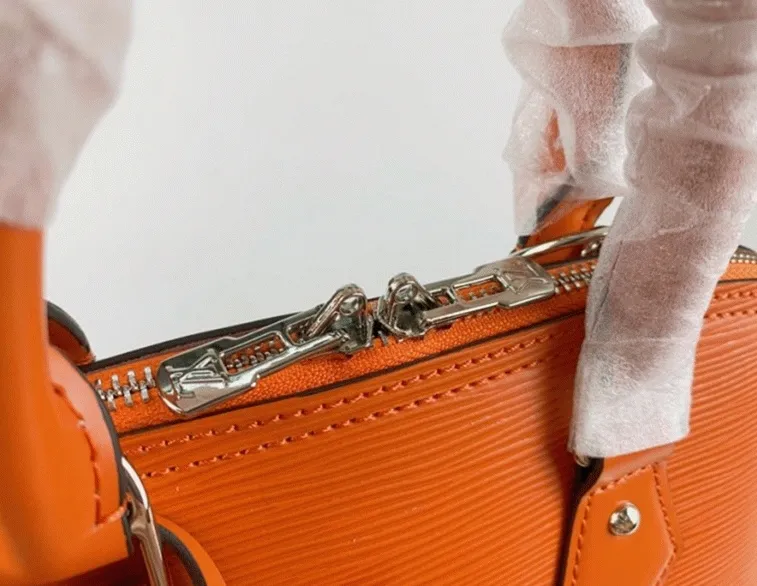 Louis Vuitton Epi Leather Alma PM Handbag In Orange With Jacquard Strap — image 3