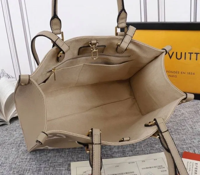 Louis Vuitton Monogram Empreinte OnTheGo MM Tote In Tourterelle Gray — image 5