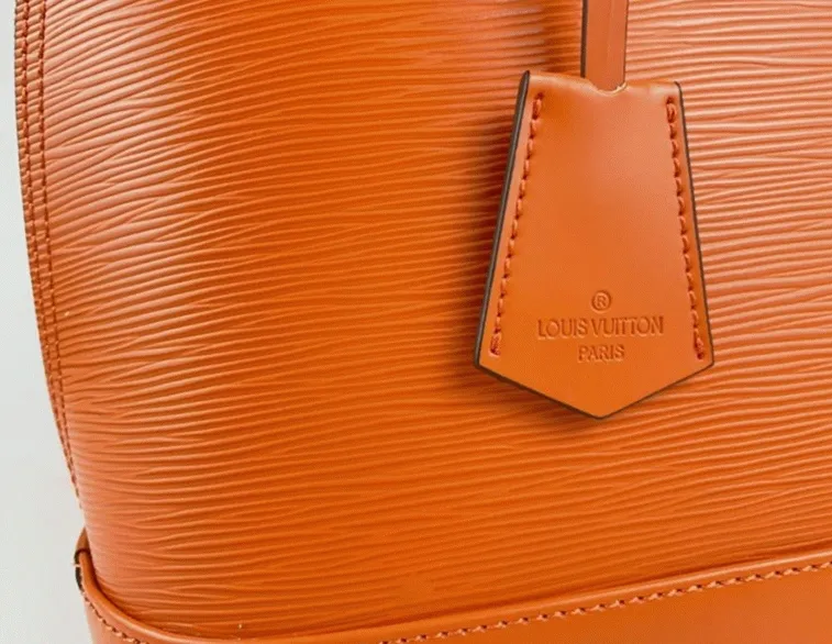 Louis Vuitton Epi Leather Alma PM Handbag In Orange With Jacquard Strap — image 2