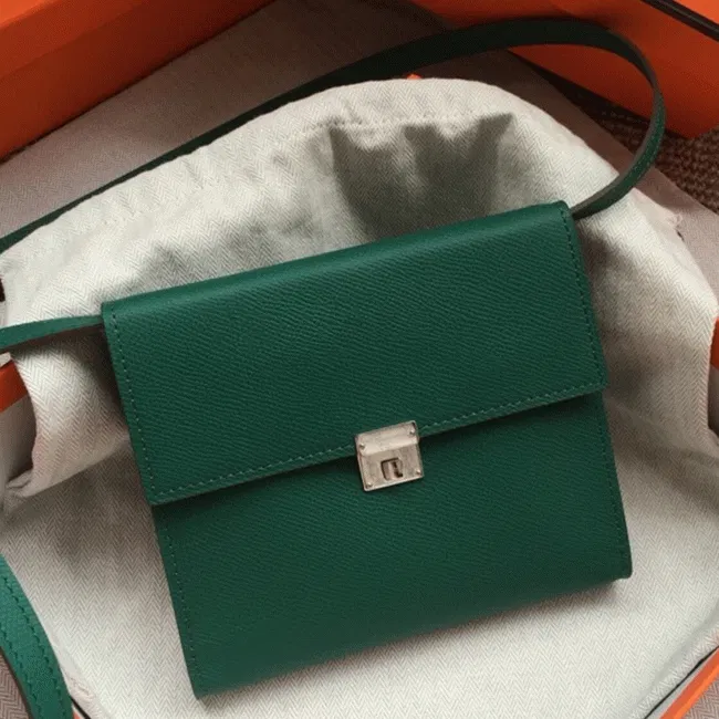 Green designer Hermes Clic wallet with strap