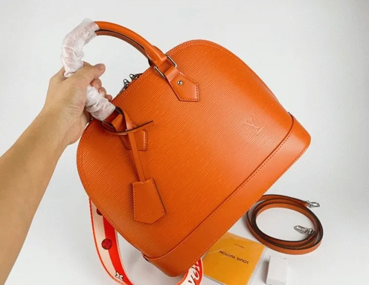 Louis Vuitton Epi Leather Alma PM Handbag In Orange With Jacquard Strap — image 8