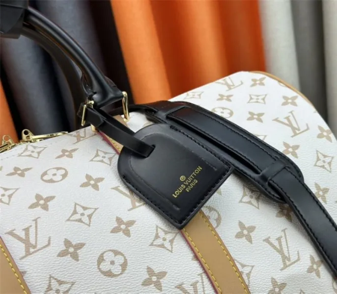 Louis Vuitton Monogram Dune Keepall Bandouliere 45 Travel Bag — image 8