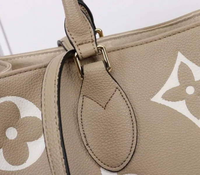 Louis Vuitton Monogram Empreinte OnTheGo MM Tote In Tourterelle Gray — image 9