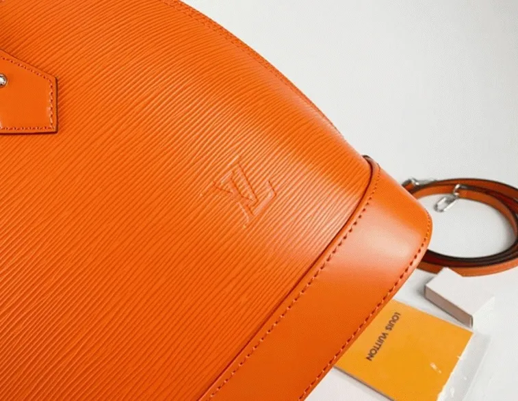 Louis Vuitton Epi Leather Alma PM Handbag In Orange With Jacquard Strap — image 7
