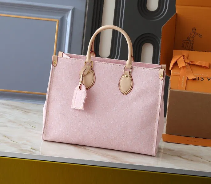 Monogram Denim OnTheGo MM In Washed Pink