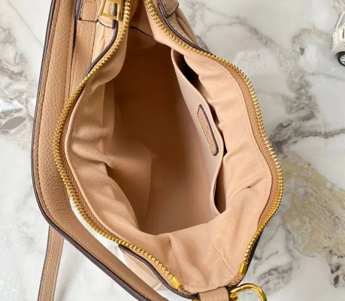 Louis Vuitton Monogram Empreinte Leather Bagatelle Mini Hobo In Beige — image 5