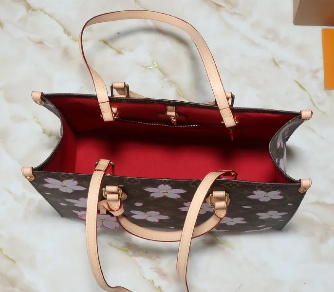 X TM Monogram Canvas Onthego MM With Cherry Blossom — image 5
