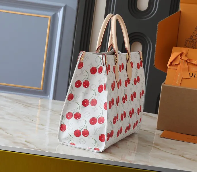 X TM Monogram Cherry Canvas Onthego MM In White Style 1 — image 2