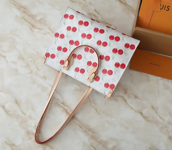 X TM Monogram Cherry Canvas Onthego MM In White Style 1 — image 5